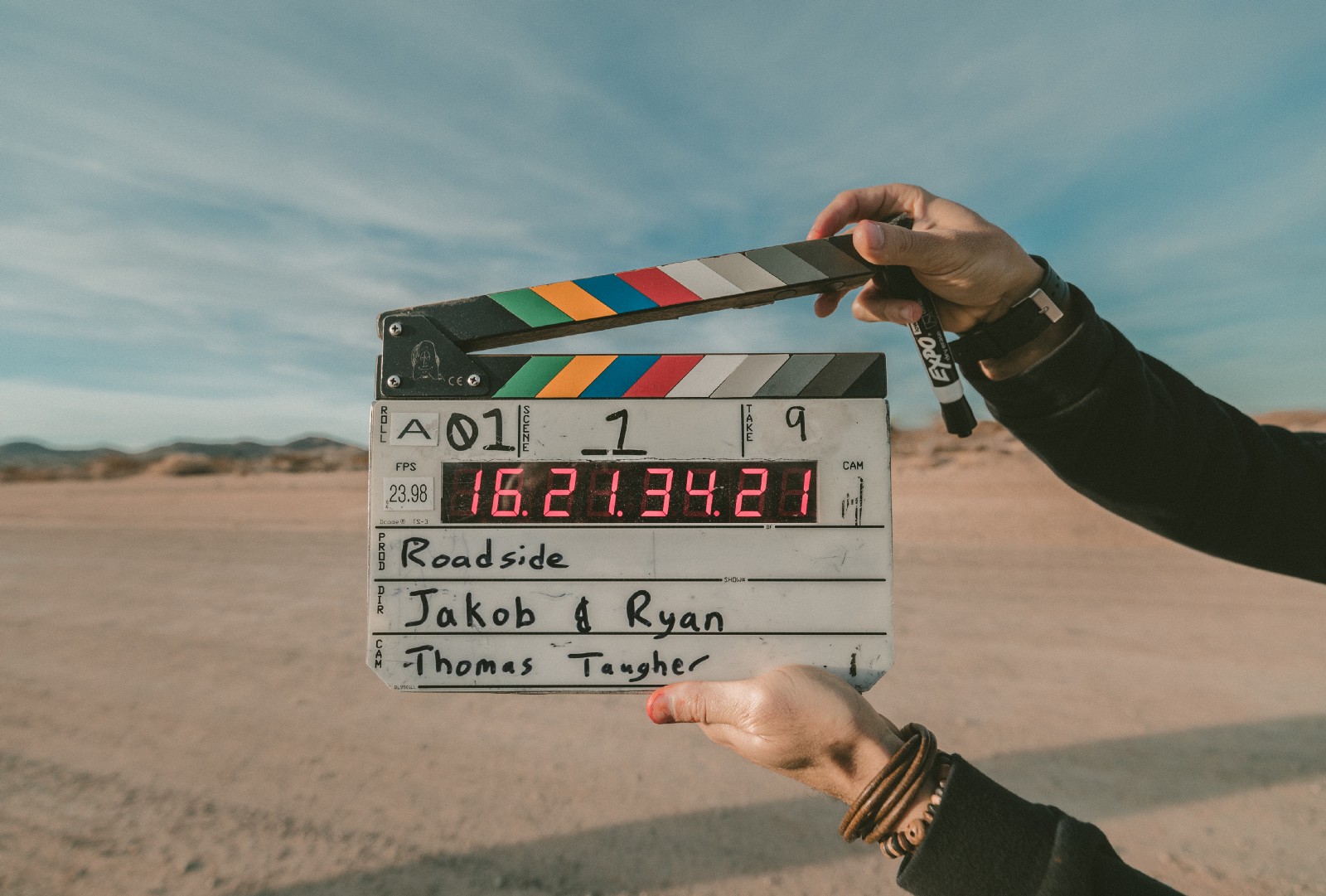 a movie board against a desert background